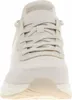 A close-up front view of a cream-colored Skechers sneaker. Produktbild-Vorschau