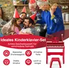 A family celebrating with party hats, with a red toy piano and stool in the foreground. Podgląd zdjęcia produktu