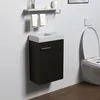 A modern bathroom scene featuring a black vanity with a white sink and a white toilet. Anteprima dell’immagine prodotto