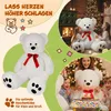 A collage of images featuring a large white teddy bear in various settings, including a cozy living room with a fireplace and a birthday party. The text suggests it's a great gift idea. Anteprima dell’immagine prodotto