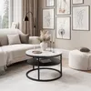 A stylish living room scene with a couch, coffee table, and artwork. Produktbild-Vorschau