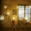 A room decorated with hanging starburst LED lights, a chair, and a table with candles. Produktbild-Vorschau