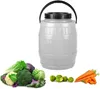 A white barrel with a black handle and lid, surrounded by various fresh vegetables including lettuce, cabbage, cauliflower, broccoli, Brussels sprouts, and carrots. Produktbild-Vorschau