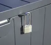 A close-up shot of a padlock securing a gray storage box. Podgląd zdjęcia produktu