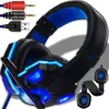 A gaming headset with blue LED lights and multiple connector cables. Produktbild-Vorschau