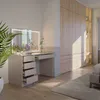 A modern bedroom with a vanity table and a large wardrobe. Produktbild-Vorschau