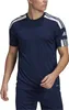 A man wearing a navy blue Adidas t-shirt with white stripes on the sleeves and shoulders. Voir les images du produit
