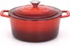 A red cast iron pot with a silver knob on its lid, presented on a white background. Anteprima dell’immagine prodotto