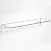 A clear acrylic shelf mounted on a white wall. Produktbild-Vorschau