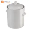 A white ceramic crock with handles and a lid, on a white background. A logo is visible in the top left corner. Podgląd zdjęcia produktu