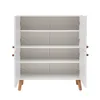 An open white cabinet with multiple shelves, standing on wooden legs, against a white background. Náhled obrázku produktu