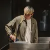 A person is using a turnstile. Produktbild-Vorschau