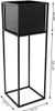 A black metal plant stand with a square planter on top, shown with dimensions indicated by measurement lines and text. Produktbild-Vorschau