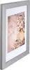 A framed picture of a woman with flowers in her hair. Produktbild-Vorschau