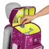 A hand is shown adjusting a clasp on a purple backpack with star patterns, displayed on a mannequin. Voir les images du produit