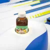 A bottle of tea is placed in a cup holder on an inflatable island. Produktbild-Vorschau