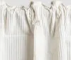 Close-up of a beige corduroy curtain with a ruffled top. Produktbild-Vorschau
