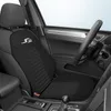 Interior view of a car's front passenger seat with a black seat cover. Produktbild-Vorschau