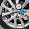 A hand is using a tire pressure gauge to check the air pressure in a car tire. Náhľad obrázku produktu