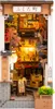 A miniature diorama of a Japanese street scene with cherry blossoms and lanterns. Voir les images du produit
