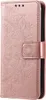 A close-up, side view of a rose gold flip phone case with a mandala embossed pattern. Produktbild-Vorschau