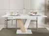 A dining table set with place settings and a bottle of water. Anteprima dell’immagine prodotto