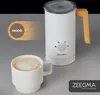 A white milk frother with a wooden handle sits next to a cup of coffee, with a graphic overlay indicating 'WOOD'. Produktbild-Vorschau