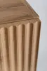 A close-up view of the fluted detail on the side of a wooden cabinet. Náhľad obrázku produktu