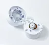 The image shows a disassembled white camera mount on a white background. Produktbild-Vorschau