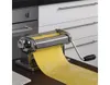 A stainless steel pasta machine with yellow dough being rolled out. Náhled obrázku produktu