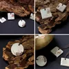 A collage of four images showcasing handmade concrete pendants with a rustic, natural aesthetic, displayed on textured wood against a dark background. Produktbild-Vorschau