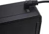 A close-up view of the corner of a black electronic device, showing a power adapter plugged into a DC 5V port. Náhled obrázku produktu
