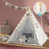 A child's play tent set up indoors with decorative elements. Podgląd zdjęcia produktu