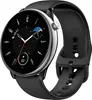 A black smartwatch with a silver bezel and a black strap is shown against a white background. The watch face displays time, date, and battery information. Podgląd zdjęcia produktu