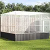 A large outdoor aviary with a dark base and a silver metal frame, set on a green lawn with trees in the background. Náhled obrázku produktu