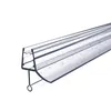A close-up, angled view of a clear plastic shower door seal with water droplets on it, set against a white background. Voir les images du produit