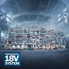 A large collection of Bosch power tools displayed in a workshop or factory setting. Podgląd zdjęcia produktu