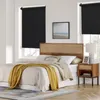 A bedroom with a bed, headboard, nightstand, and window with blinds. Produktbild-Vorschau