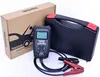 A car battery and alternator tester, its carrying case, and its packaging are arranged on a white background. Náhled obrázku produktu