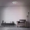 A modern living room with a brick wall, a sofa, a media console, and a floor lamp. Produktbild-Vorschau
