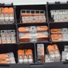 A close-up view of a black organizer box filled with Wago lever connectors. Produktbild-Vorschau