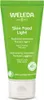 A green tube of Weleda Skin Food Light cream with white text and a white cap. Voir les images du produit