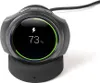 A smartwatch charging dock with a smartwatch displaying its charging status. Náhľad obrázku produktu