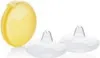 A yellow storage box and two white breast shells are displayed against a white background. Anteprima dell’immagine prodotto