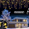 A modern house decorated with icicle lights for Christmas. Anteprima dell’immagine prodotto