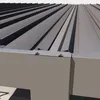 A close-up view of the edge of a metal roof or pergola structure, showing the connection between the roof panels and the supporting structure. Voir les images du produit