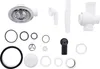 A collection of plumbing parts, including a sink strainer, pipes, and seals, laid out on a white background. Produktbild-Vorschau