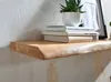 A wooden shelf with books and a plant on it, mounted on a textured wall. Voir les images du produit