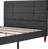 A close-up view of a dark gray upholstered bed frame with a slatted base and wooden legs. Produktbild-Vorschau