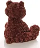 A brown teddy bear is shown from the back, sitting on a white surface. Anteprima dell’immagine prodotto